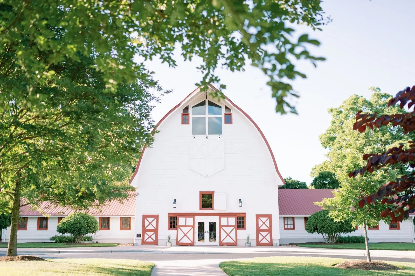 The Main Barn at WinMock, white with red trim